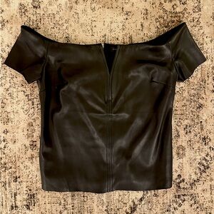 Black Dynamite leather off the shoulder top.